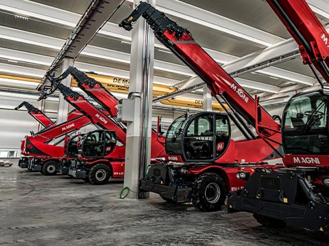 Red telehandlers in a row